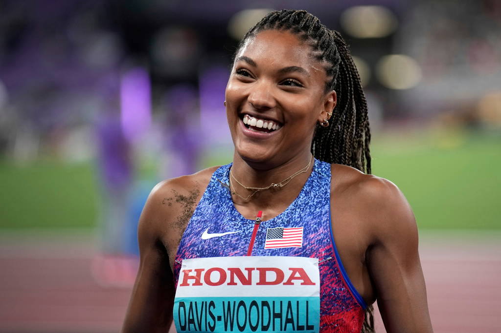 FILE - United States' Tara Davis-Woodhall smiles after winning the gold medal in the women's long jump final at the World Athletics Championships in Tokyo, Sunday, Sept. 14, 2025. (AP Photo/Louise Delmotte, File)