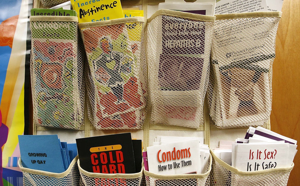 FILE - Pamphlets line the door to the health clinic at King Middle School in Portland, Maine, on April 18, 2008. (AP Photo/Cheryl Senter, File)