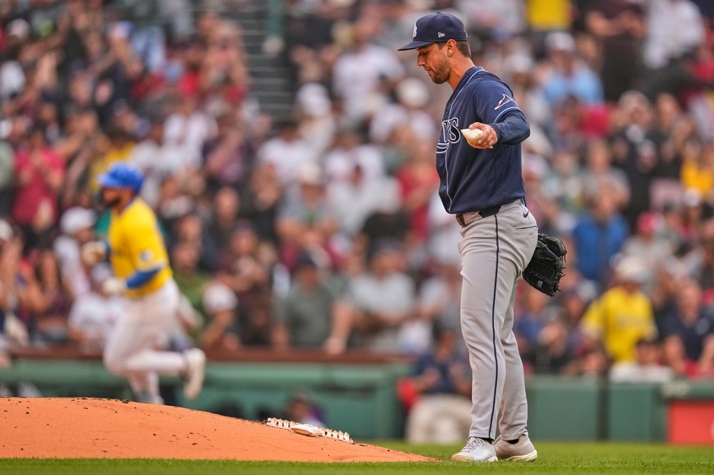 Tampa Bay Rays' Ian Seymour, right, prepares for the next batter as Boston Red Sox's Wilyer Abreu, back left, rounds the bases on a solo home run in the third inning of a baseball game, Saturday, July 18, 2026, in Boston. (AP Photo/Charles Krupa)