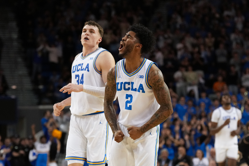 UCLA guard Donovan Dent (2) celebrates his basket during the first half of an NCAA college basketball game against Purdue in Los Angeles, Tuesday, Jan. 20, 2026. (AP Photo/Jae C. Hong)