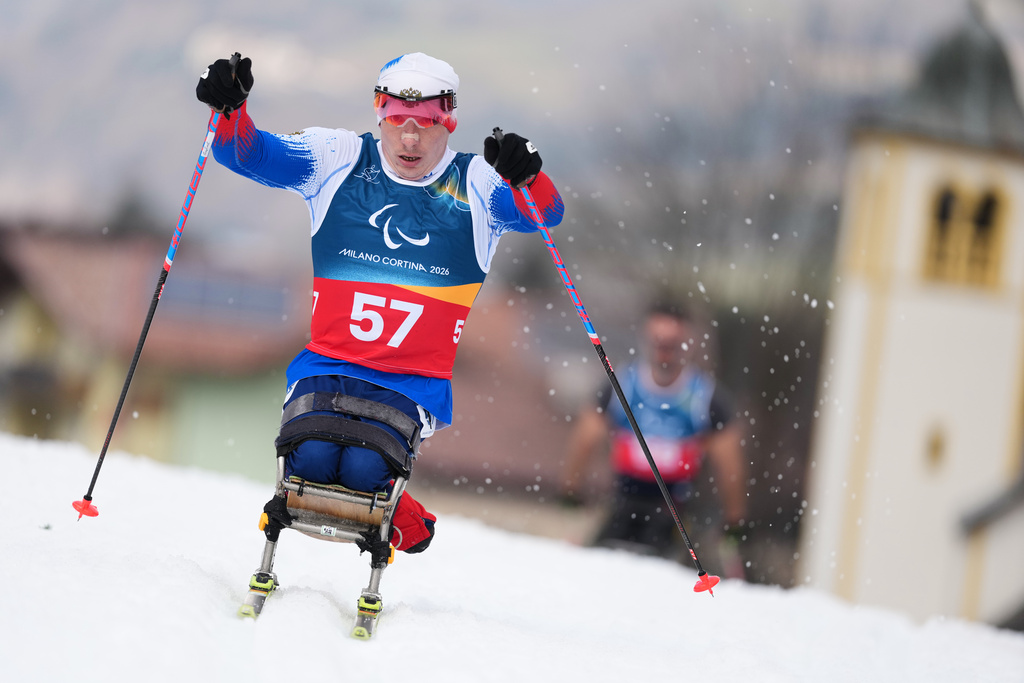 Ivan Golubkov, of Russia, competes in the cross country skiing men's 10Km interval start sitting final at the 2026 Winter Paralympics, in Tesero, Italy, Wednesday, March 11, 2026. (AP Photo/Evgeniy Maloletka)