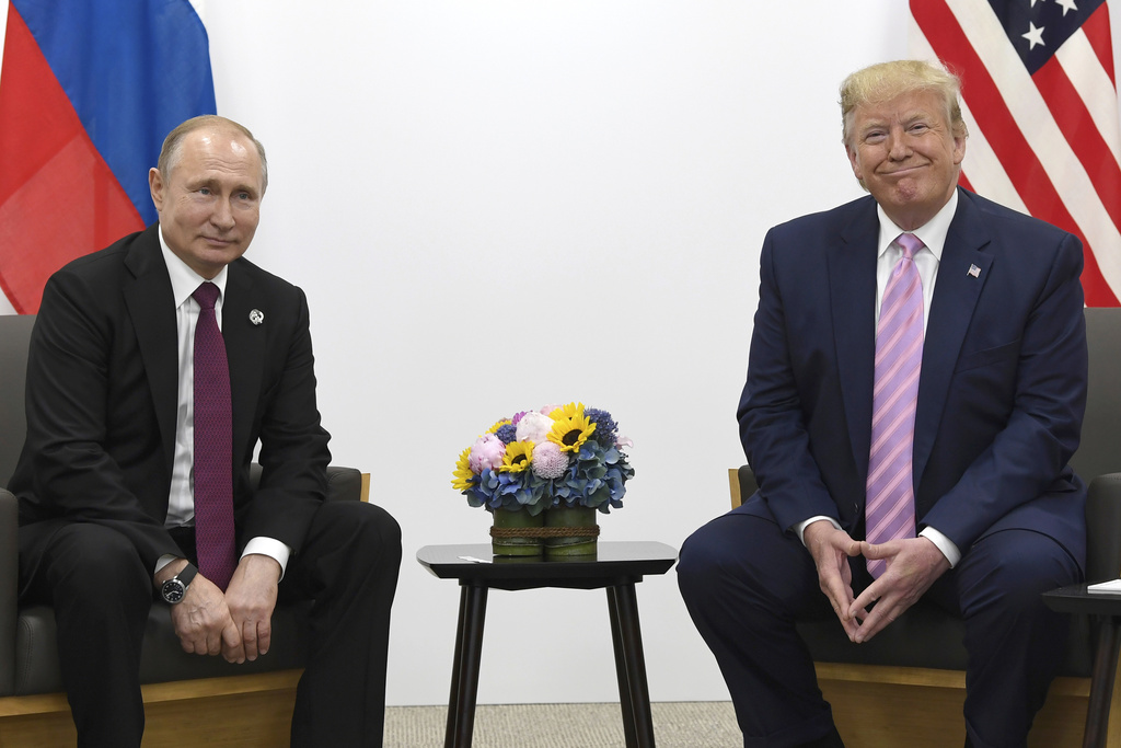 FILE - President Donald Trump, right, meets with Russian President Vladimir Putin on the sidelines of the G-20 summit in Osaka, Japan, June 28, 2019. (AP Photo/Susan Walsh, File)