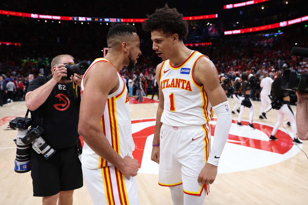 Atlanta Hawks guard CJ McCollum, left, and forward Jalen Johnson, right, react after Game 3 of a first-round NBA playoffs basketball series against the New York Knicks, Thursday, April 23, 2026, in Atlanta. (AP Photo/Colin Hubbard)