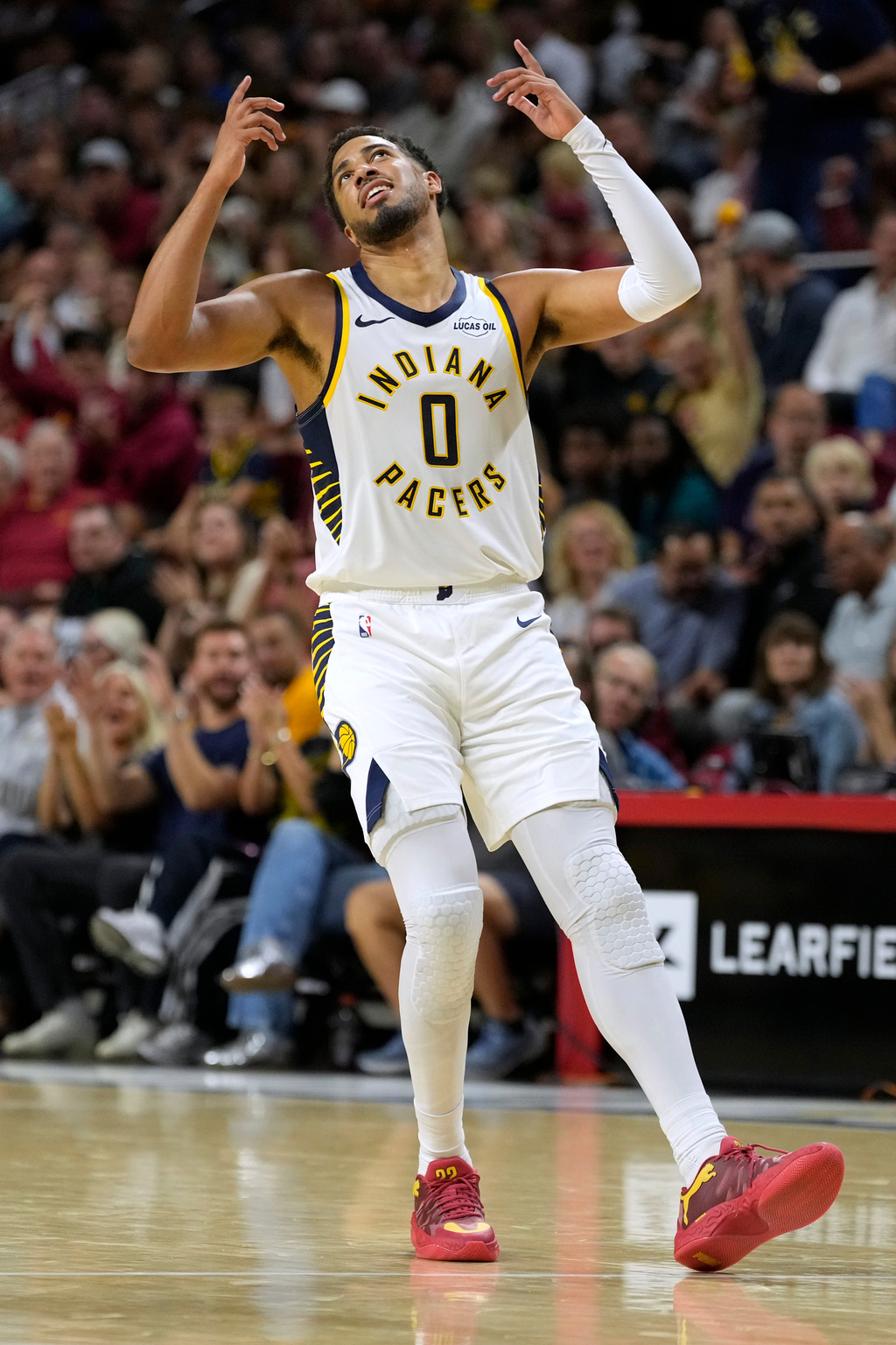 Indiana Pacers guard Tyrese Haliburton reacts after making a three-point basket during the first half of a preseason NBA basketball game against the Minnesota Timberwolves, Wednesday, Oct. 7, 2026, in Ames, Iowa. (AP Photo/Charlie Neibergall)