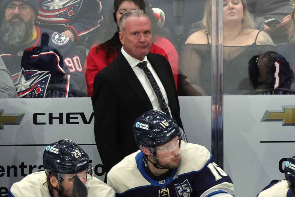 Columbus Blue Jackets coach Dean Evason watches his team during the third period of an NHL hockey game against the New Jersey Devils in Columbus, Ohio, Wednesday, Dec. 31, 2025. (AP Photo/Paul Vernon)