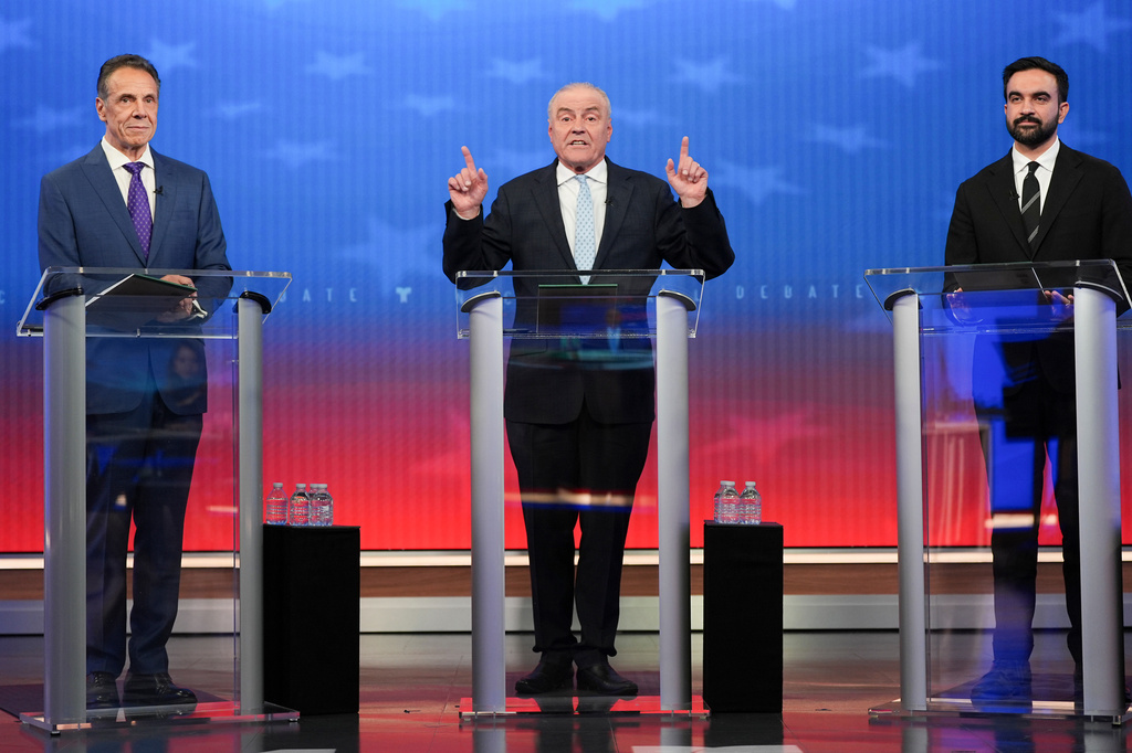 Republican candidate Curtis Sliwa, center, speaks during a mayoral debate with Independent candidate former New York Gov. Andrew Cuomo, left, and Democratic candidate Zohran Mamdani, Thursday, Oct. 16, 2025, in New York. (AP Photo/Angelina Katsanis, Pool)