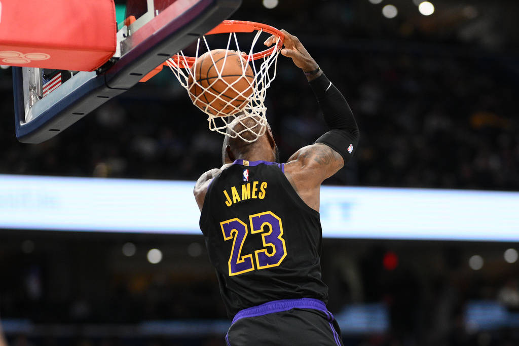 Los Angeles Lakers forward LeBron James does a reverse dunk during the second half of an NBA basketball game against the Washington Wizards, Friday, Jan. 30, 2026, in Washington. (AP Photo/Nick Wass)