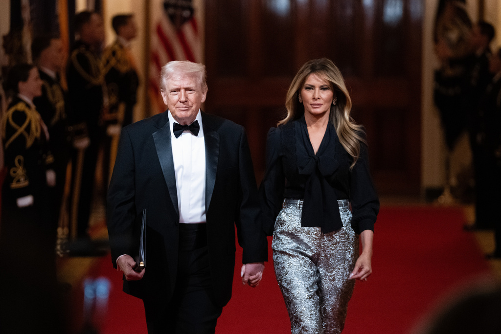 President Donald Trump and first lady Melania Trump arrive at the National Governors Association dinner at the White House, Saturday, Feb. 21, 2026, in Washington. (AP Photo/Allison Robbert)