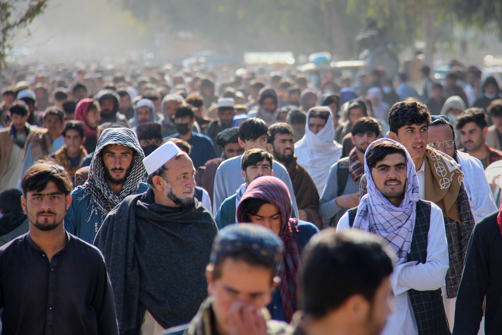 A crowd leaves a stadium after attending the public execution, carried out by Taliban authorities, of a man sentenced by the Supreme Court for killing 13 members of a family, including children, earlier this year, in the eastern city of Khost, eastern Afghanistan, Tuesday, Dec. 2, 2025. (AP Photo/Saifullah Zahir)
