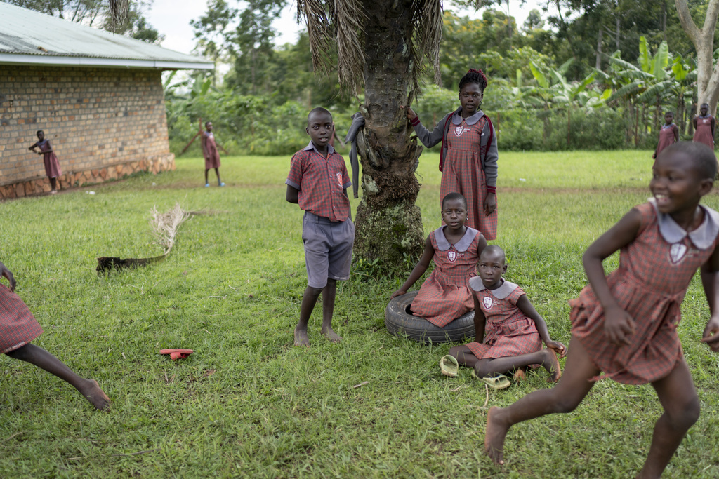Students play at a special school for children being raised by their grandparents run by the NGO Reach One Touch One Ministries to help support seniors in the community, in Magogo, Uganda, Saturday, Nov. 16, 2024. (AP Photo/David Goldman)