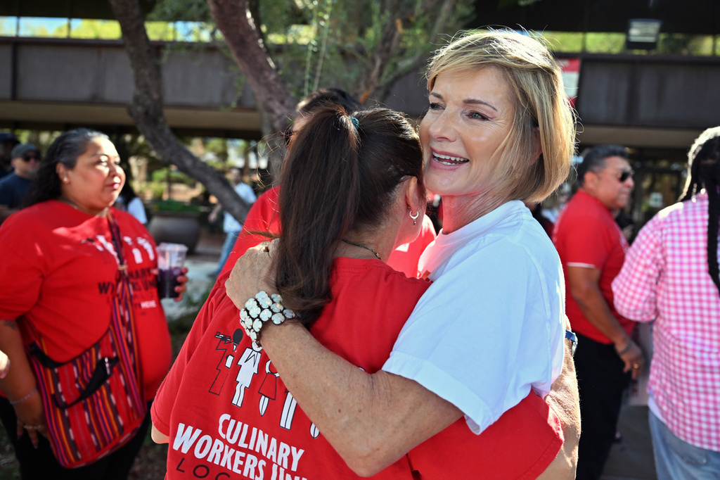 Rep. Susie Lee, D-Nev, embraces a union worker on Saturday, Sept. 12, 2026, in Las Vegas. (AP Photo/David Becker)