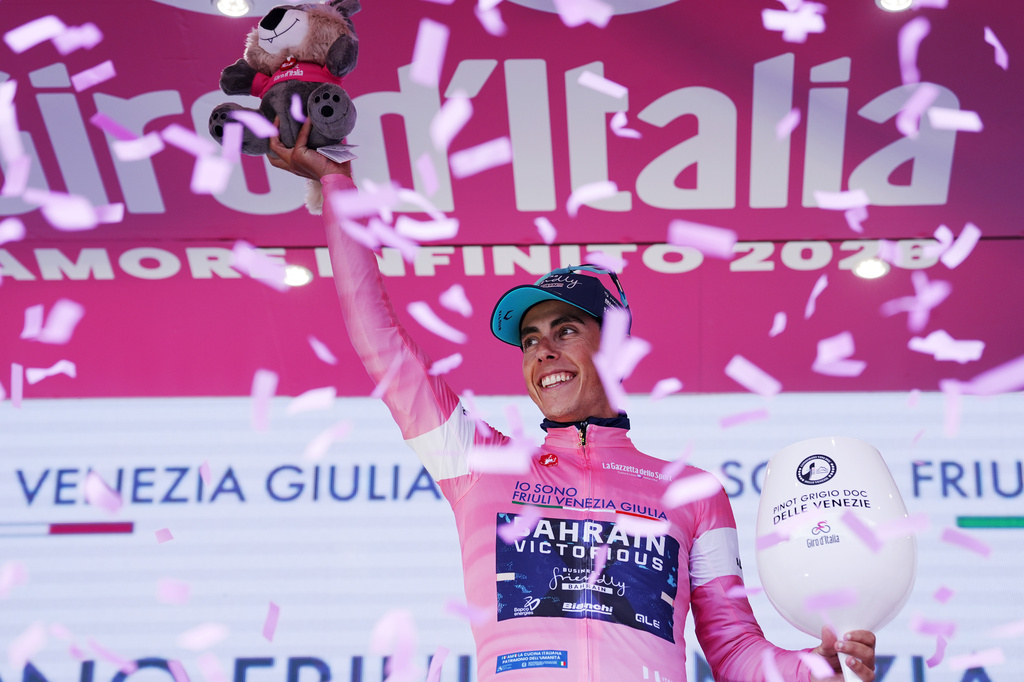 Portugal's Afonso Oliveira Eulalio wears the pink jersey of the race overall leader as he poses on the podium after completing the 6th stage of the Giro d'Italia cycling race, from Paestum to Naples, Italy, Thursday, May 14, 2026. (Massimo Paolone/LaPresse via AP)
