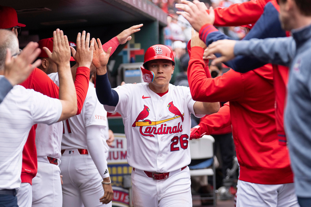 St. Louis Cardinals' JJ Wetherholt is congratulated by teammates after scoring during the sixth inning of a baseball game against the New York Mets Wednesday, April 1, 2026, in St. Louis. (AP Photo/LG Patterson)