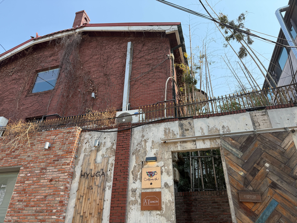 An exterior view of cafe HYUGA, a former trainee dormitory for K-pop band BTS now converted into a cafe, appears in Seoul, South Korea, Friday, March 20, 2026. (AP Photo/Juwon Park)