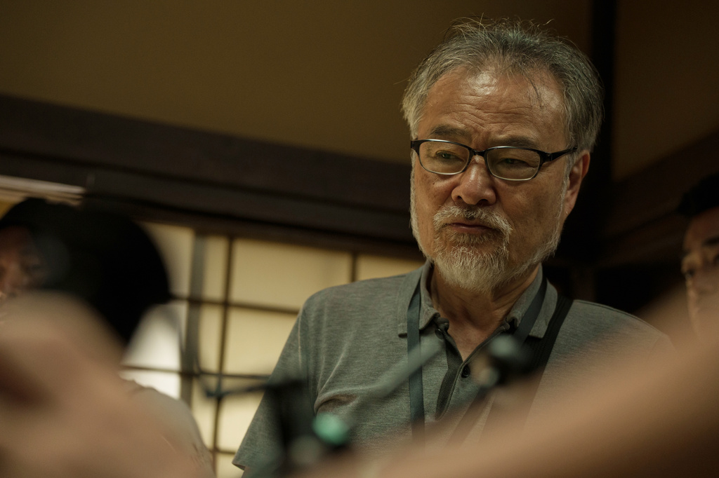 This image released by Janus Films shows Kiyoshi Kurosawa on the set of "The Samurai and the Prisoner." (Janus Films via AP)