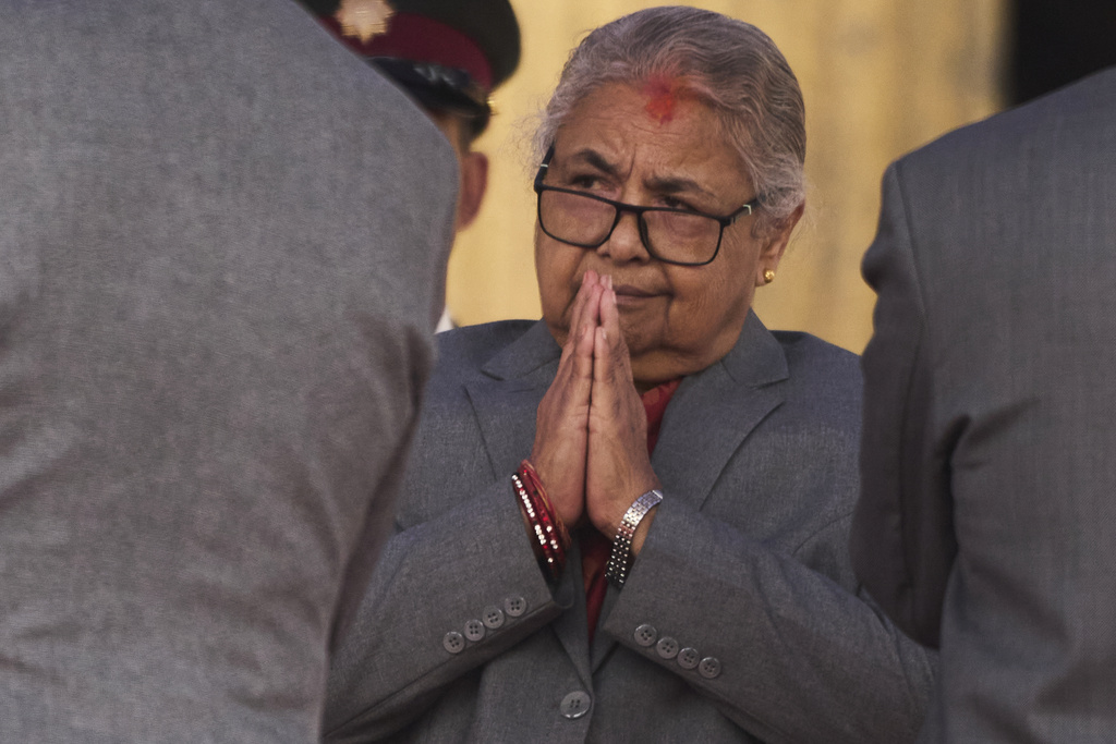 Nepal's new prime minister Sushila Karki greets ministers administered the oath of office by Nepalese President Ram Chandra Poudel at the presidential building in Kathmandu, Nepal, Monday, Sept. 15, 2025. (AP Photo/Niranjan Shrestha)