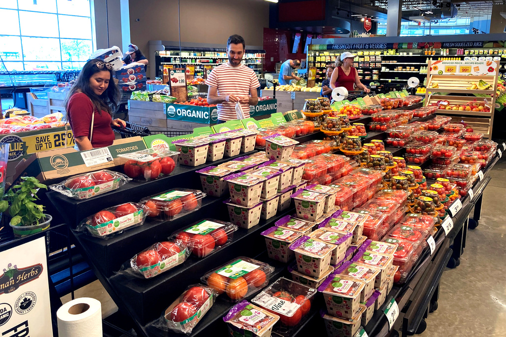 FILE - People shop at a grocery store in Glenview, Ill., Monday, July 4, 2022. (AP Photo/Nam Y. Huh, File)
