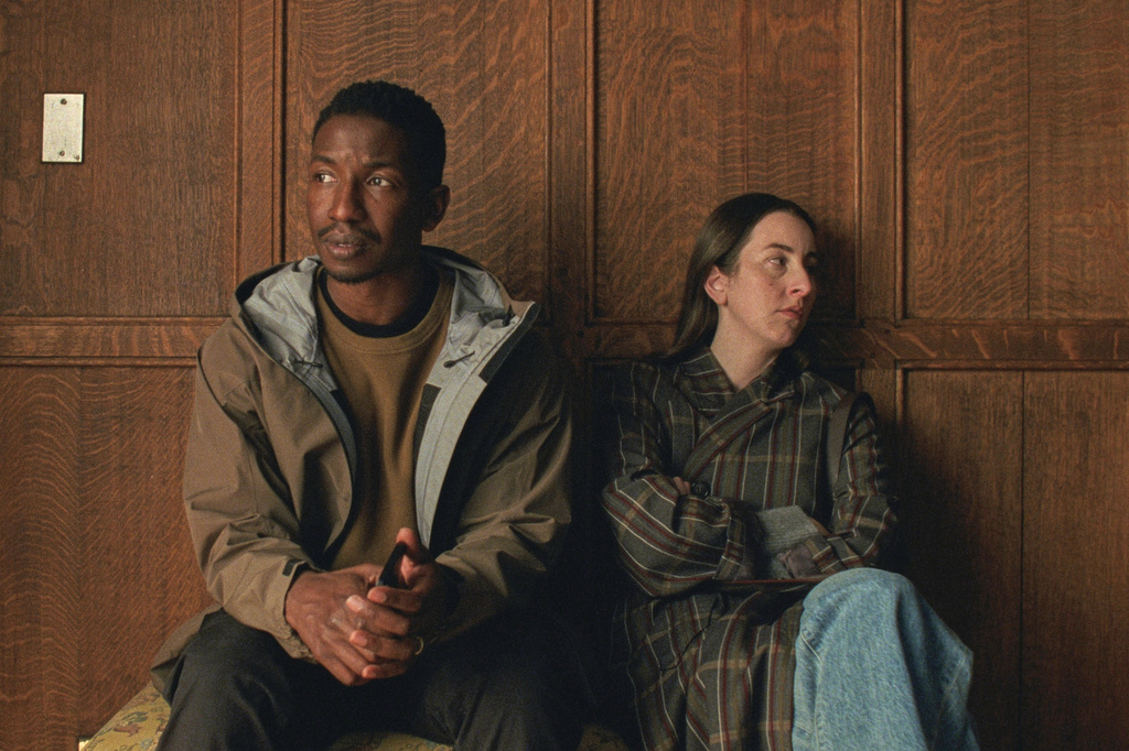 This image released by A24 shows Mamoudou Athie, left, and Alana Haim in a scene from "The Drama." (A24 via AP)
