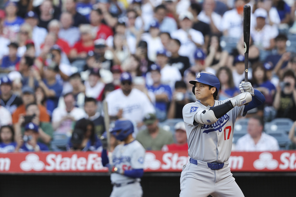 Los Angeles Dodgers designated hitter Shohei Ohtani (17) prepares to bat during the first inning of a baseball game against the Los Angeles Angels, Monday, Aug. 11, 2025, in Anaheim, Calif. (AP Photo/Jessie Alcheh)