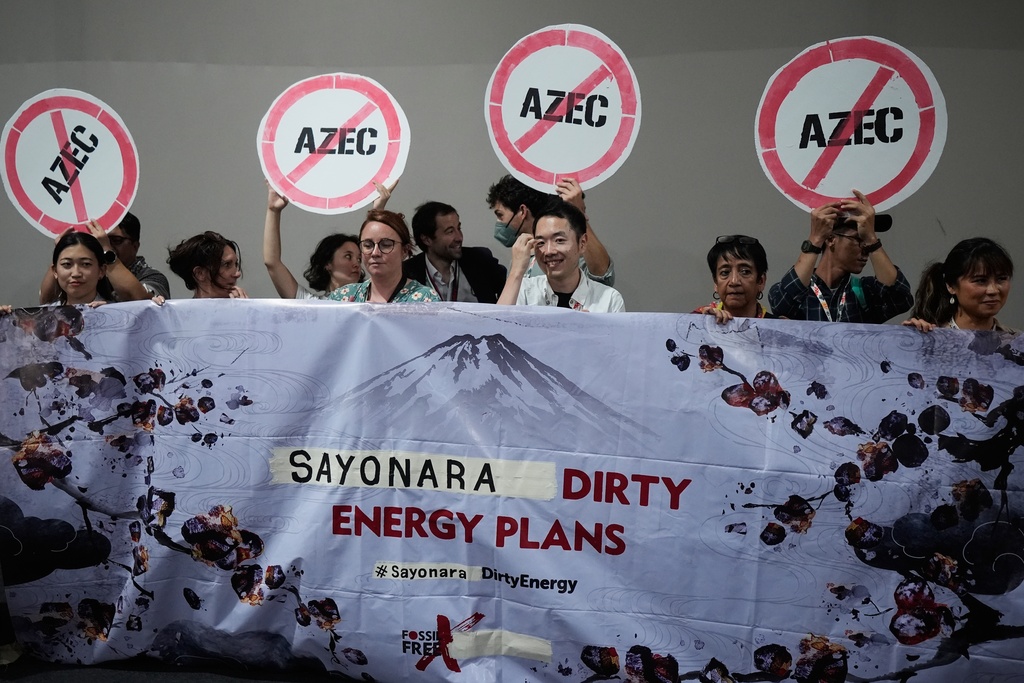 Activists protest Japan's financing of coal and natural gas projects during the COP30 U.N. Climate Summit, Friday, Nov. 14, 2025, in Belem, Brazil. (AP Photo/Fernando Llano)