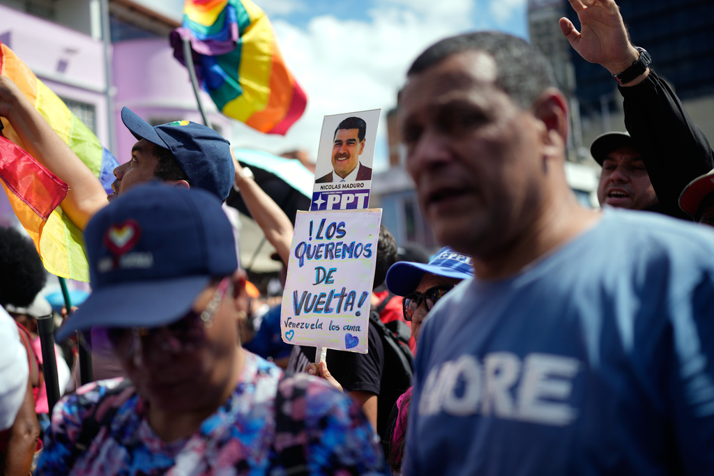 Supporters of the Venezuelan government rally calling for the release of former Venezuelan President Nicolas Maduro and his wife, Cilia Flores, who were captured by U.S. forces, in Caracas, Venezuela, Friday, Jan. 9, 2026. (AP Photo/Ariana Cubillos)