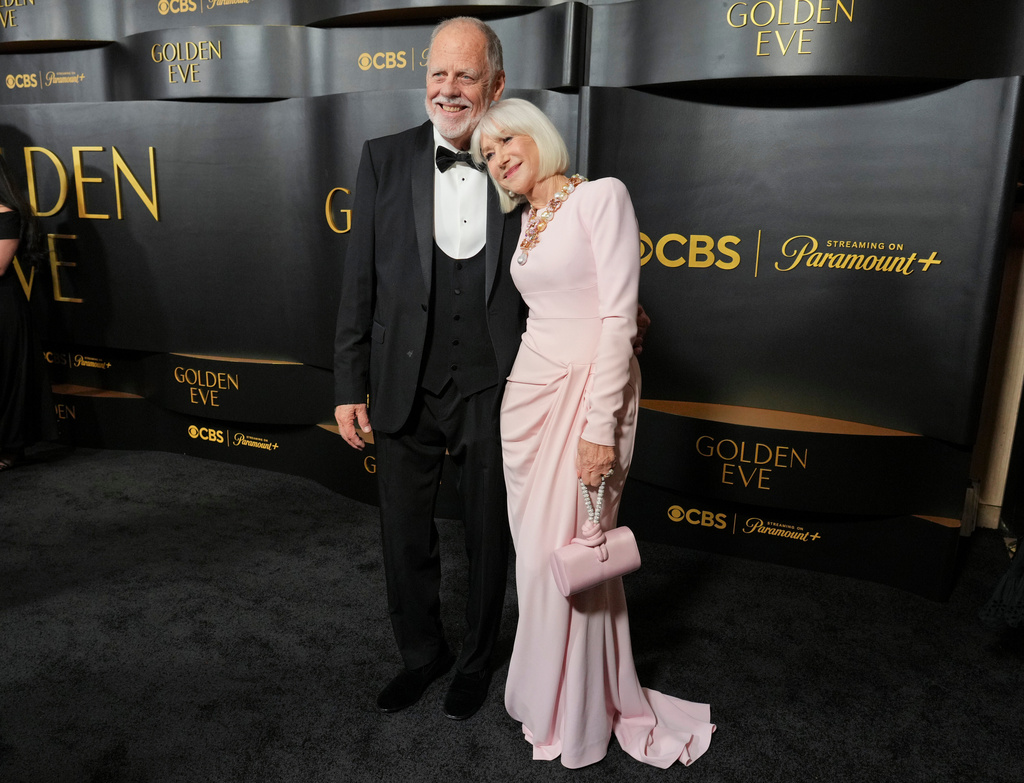 Taylor Hackford, left, and Helen Mirren arrive at the Golden Globes Golden Eve on Tuesday, Jan. 6, 2026, at The Beverly Hilton Hotel, in Beverly Hills, Calif. (Photo by Jordan Strauss/Invision/AP)