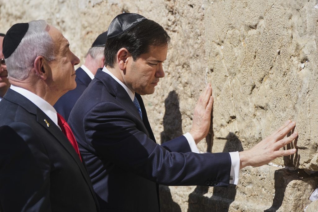 Israeli Prime Minister Benjamin Netanyahu, left, and U.S. Secretary of State Marco Rubio visit the Western Wall, the holiest site where Jews can pray, in the Old City of Jerusalem Sunday, Sept. 14, 2025. (AP Photo/Ariel Schalit)