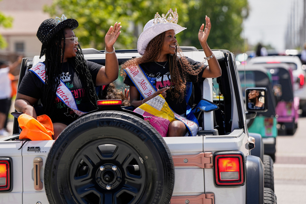 FILE - People participate during a Juneteenth parade, June 19, 2025, in Galveston, Texas. (AP Photo/David J. Phillip, File)