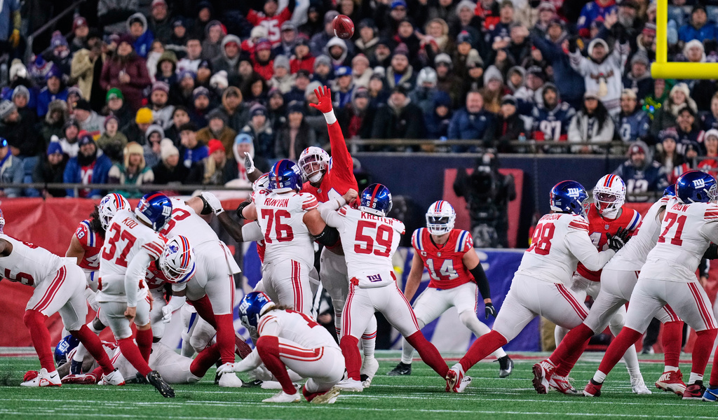New York Giants kicker Younghoe Koo (37) kicks during the first half of an NFL football game against the New England Patriots, Monday, Dec. 1, 2025, in Foxborough, Mass. (AP Photo/Charles Krupa, File)