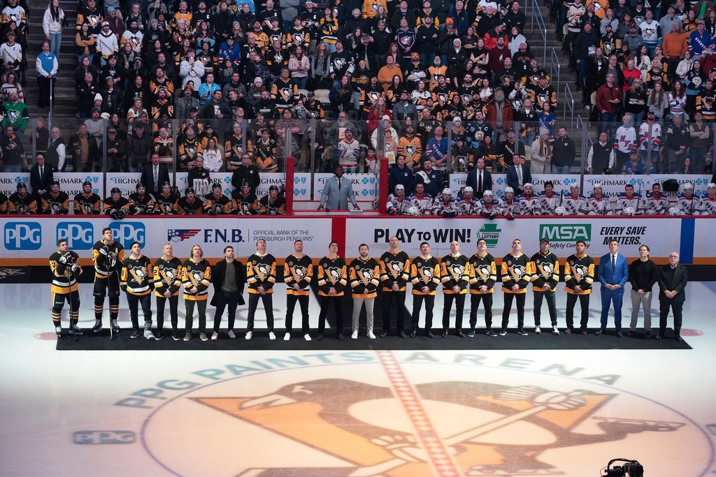 Members of the 2016 Stanley Cup Champion Pittsburgh Penguins are honored before an NHL hockey game against the New York Rangers in Pittsburgh, Saturday, Jan. 31, 2026. (AP Photo/Gene J. Puskar)