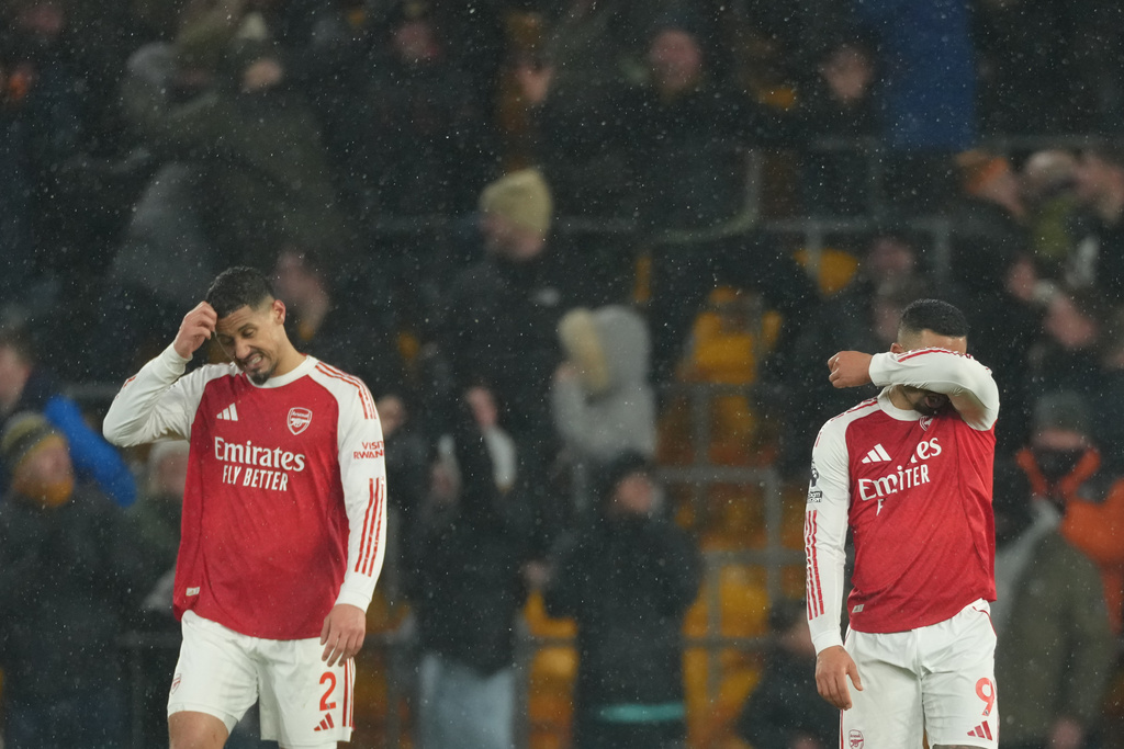 Arsenal's Gabriel Jesus and William Saliba react during the Premier League soccer match between Wolverhampton Wanderers and Arsenal in Wolverhampton, England, Wednesday, Feb. 18, 2026. (AP Photo/Dave Shopland)