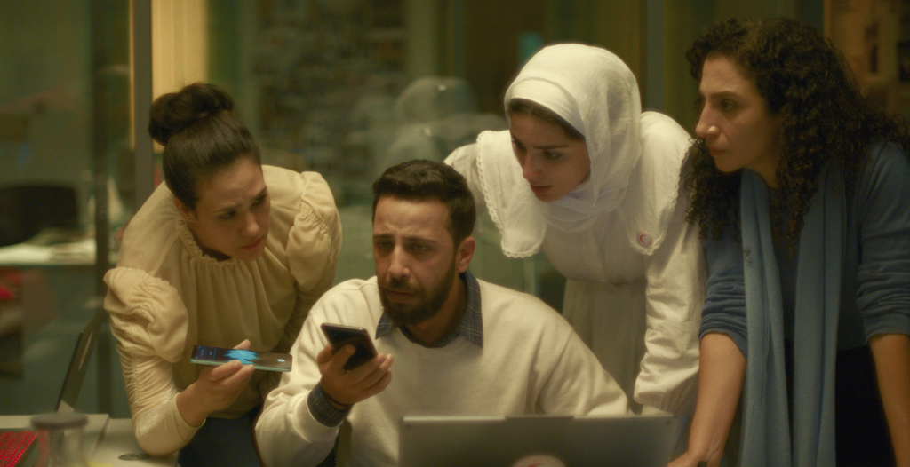 This image released by Mime Films/Tanit Films shows Nesbat Sarha, from left, Motaz Malhees, Saja Kilani and Clara Khoury in a scene from" The Voice of Hind Rajab." (Mime Films/Tanit Films via AP)