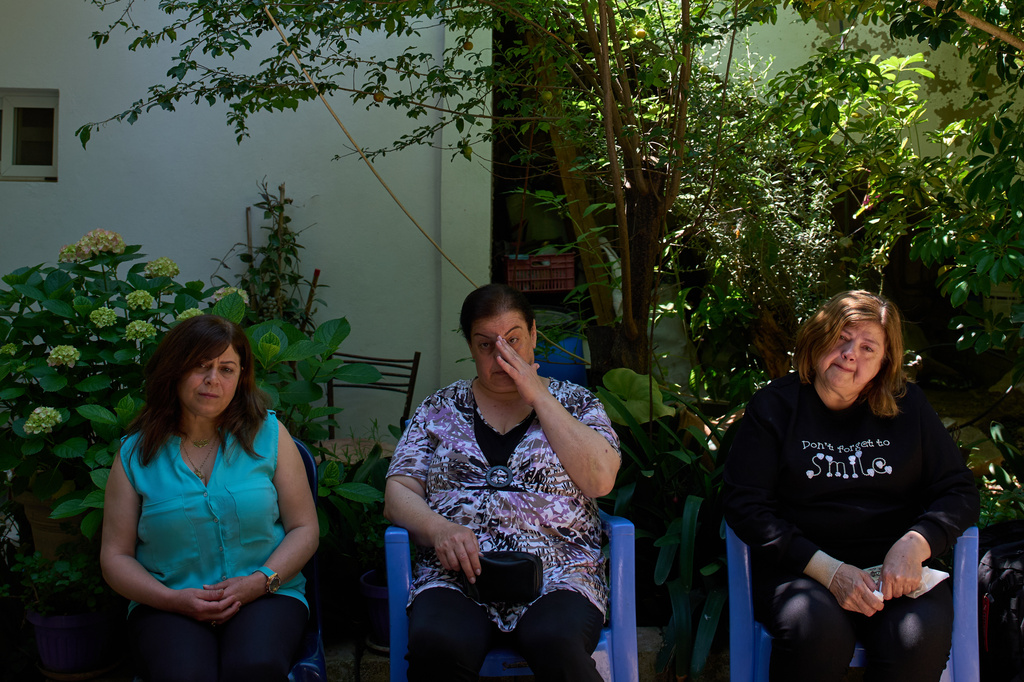 From left, Lolitta Costantine, Wadiaa Salloum, and Marie Salloum sit outside Costantine's home in the southern town of Jdeidat Marjayoun, Lebanon, Thursday, June 11, 2026. (AP Photo/Hassan Ammar) CORRECTION: City corrected to Jdeidat Marjayoun, instead of Marjayoun.