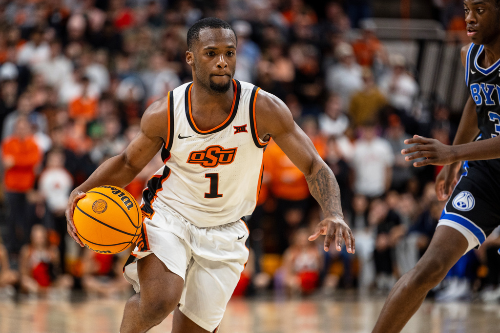 FILE - Oklahoma State guard Kanye Clary drives with the ball in the second half of an NCAA college basketball game against BYU, Feb. 4, 2026 in Stillwater, Okla. (AP Photo/Mitch Alcala, File)