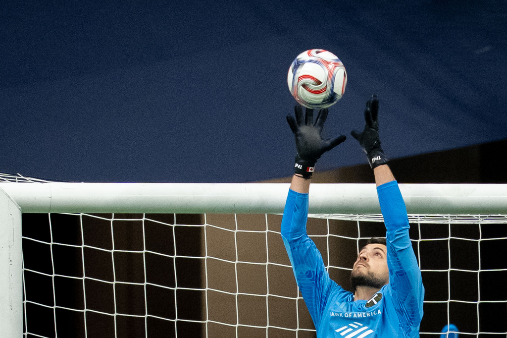 Portland Timbers goalkeeper James Pantemis (41) stops the ball against the Vancouver Whitecaps during the first half of an MLS soccer match in Vancouver, British Columbia, on Saturday, April 4, 2026. (Ethan Cairns/The Canadian Press via AP)