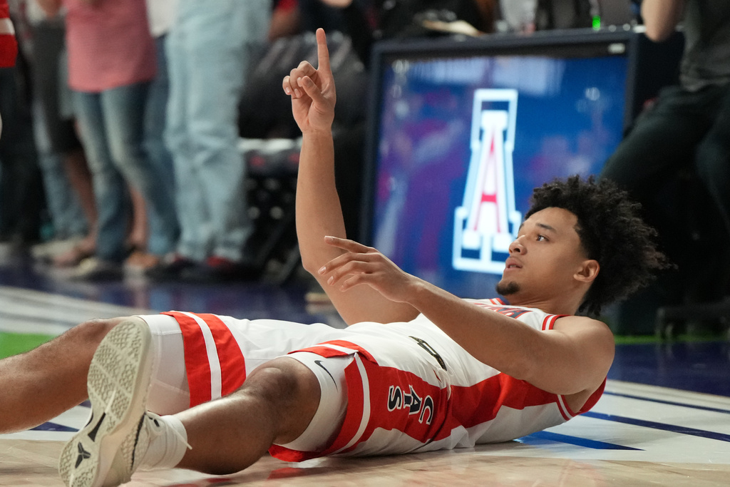 Arizona guard Brayden Burries reacts after scoring against Northern Arizona during the first half of an NCAA college basketball game, Tuesday, Nov. 11, 2025, in Tucson, Ariz. (AP Photo/Rick Scuteri)