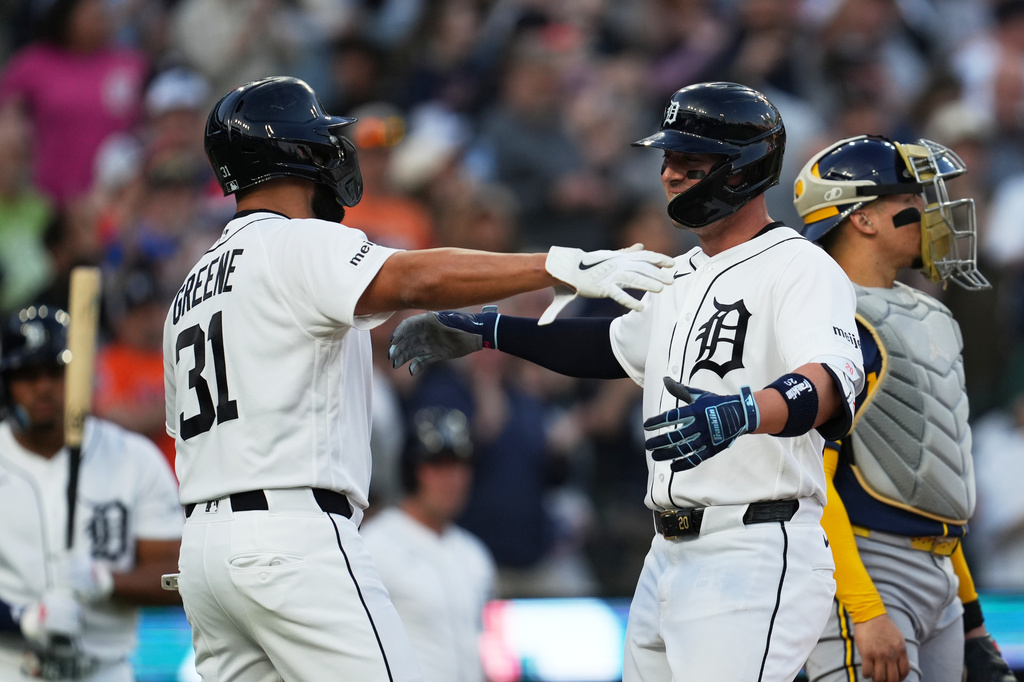 Detroit Tigers' Spencer Torkelson, right, celebrates his two-run home run with Riley Greene (31) against the Milwaukee Brewers during the fourth inning of a baseball game Wednesday, April 22, 2026, in Detroit. (AP Photo/Paul Sancya)