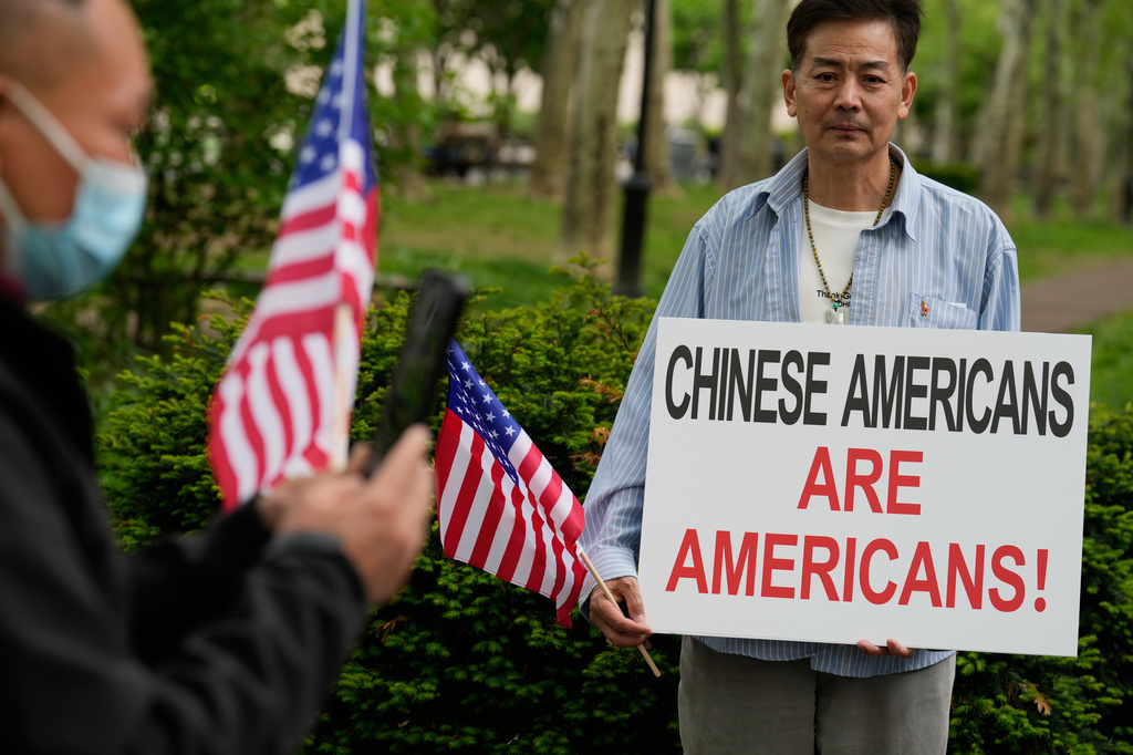 Supporters of Lu Jianwang, also known as Harry Lu, stand outside a federal courthouse before the opening of his trial in New York, Wednesday, May 6, 2026. (AP Photo/Seth Wenig)