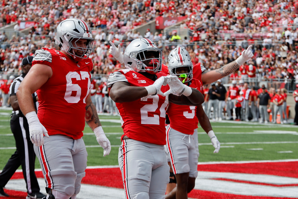 Ohio State running back Ja'Kobi Jackson, center, celebrates his touchdown against Kent State during the first half of an NCAA college football game, Saturday, Sept. 19, 2026, in Columbus, Ohio. (AP Photo/Jay LaPrete)