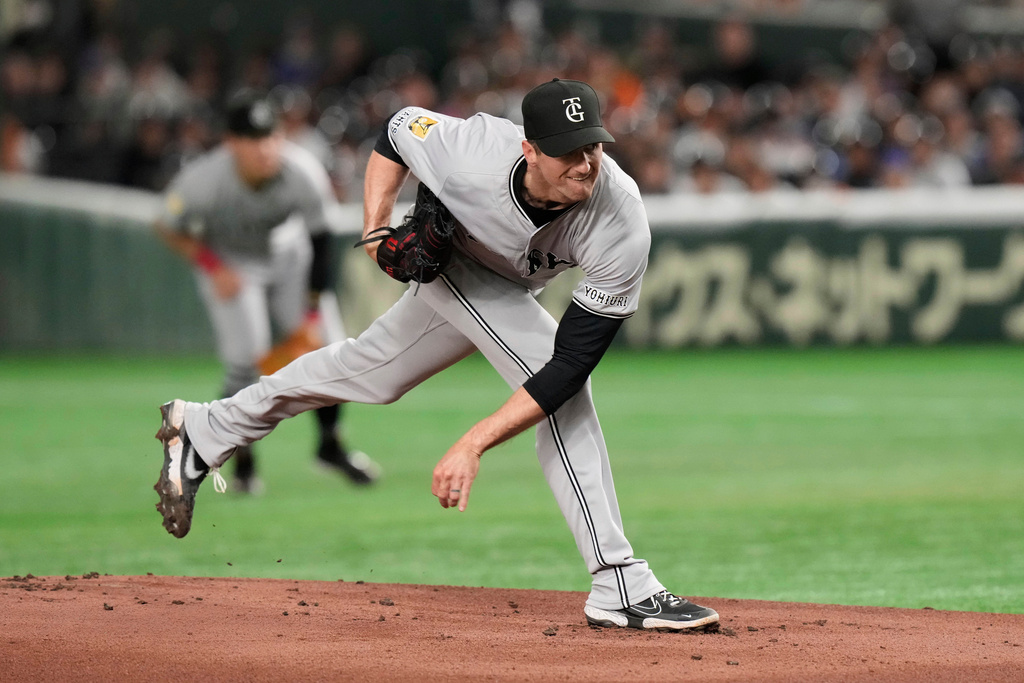 FILE - Yomiuri Giants pitcher Foster Griffin throws to the Chicago Cubs in the first inning of an MLB Japan Series exhibition baseball game in Tokyo, Japan, Sunday, March 16, 2025. (AP Photo/Eugene Hoshiko, File)