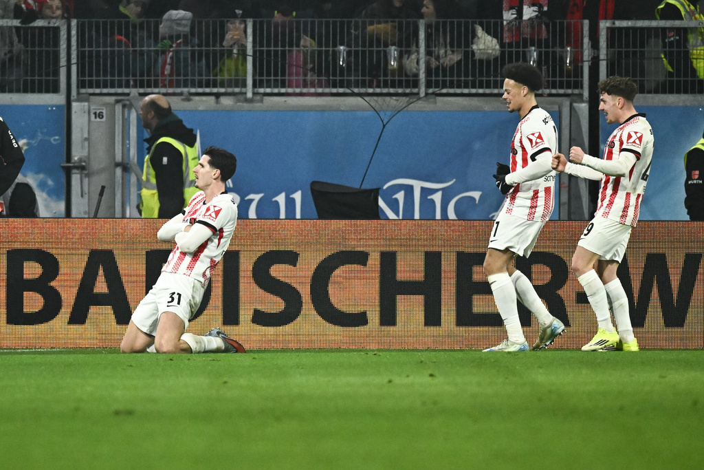 Freiburg's Igor Matanovic, left, celebrates after scoring during the German Bundesliga soccer match between SC Freiburg and 1. FC Cologne in Freiburg im Breisgau, Germany, Sunday, Jan. 25. 2026. (Silas Stein/dpa via AP)