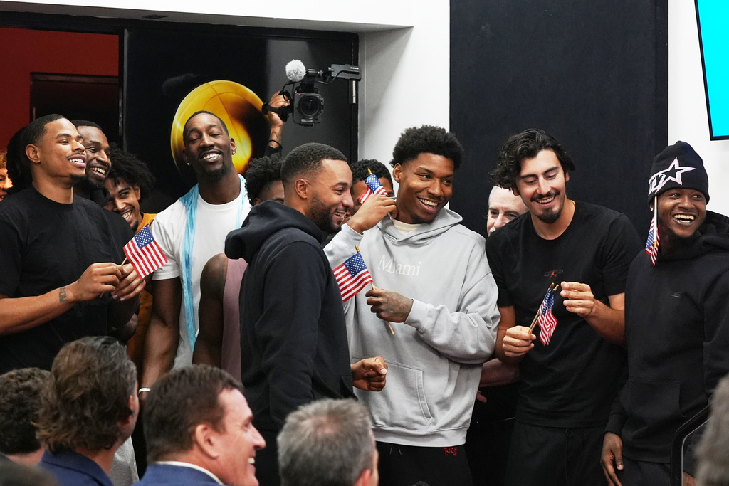 Miami Heat players applaud as their head coach Erik Spoelstra, announces that he accepted the USA Basketball men's national team head coach position during a news conference Thursday, Oct. 16, 2025, in Miami. (AP Photo/Marta Lavandier)