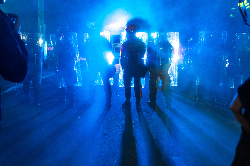 Law enforcement officers in riot gear stand off against anti-ICE protesters outside the Delaney Hall detention center on Saturday, May 30, 2026, in Newark, N.J. (AP Photo/Angelina Katsanis)