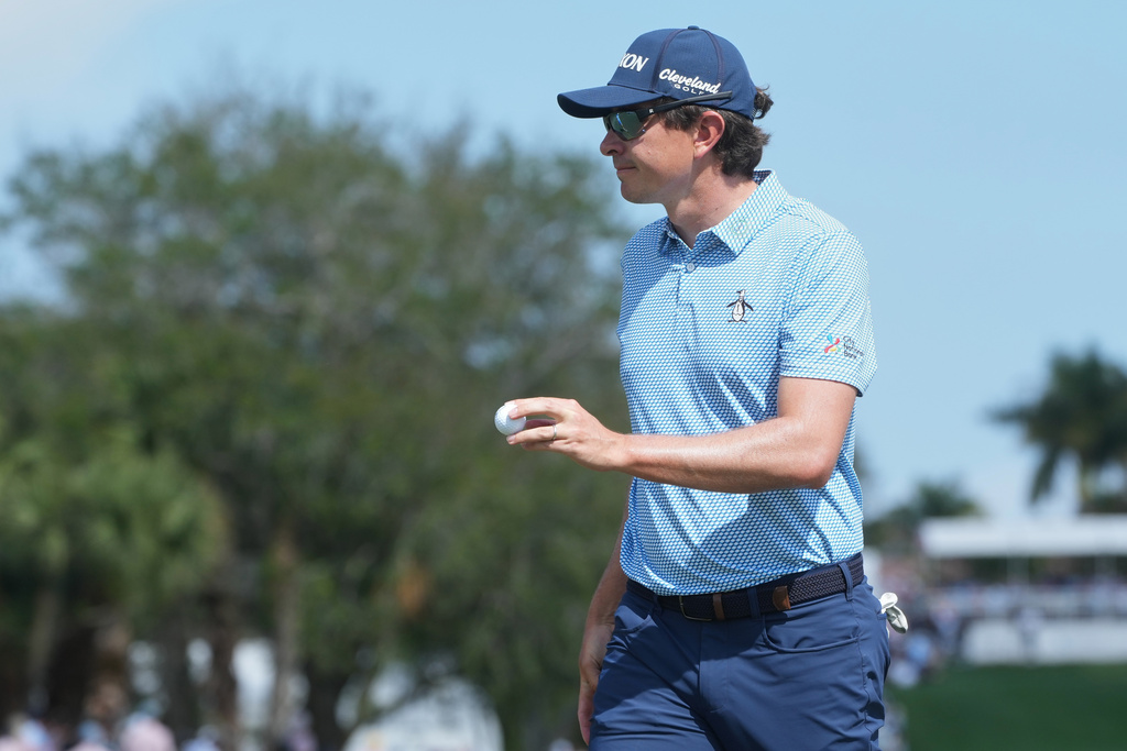 Nico Echavarria of Colombia show his ball on the first green during the final round of the Cognizant Classic golf tournament, Sunday, March 1, 2026, in Palm Beach Gardens, Fla. (AP Photo/Marta Lavandier)