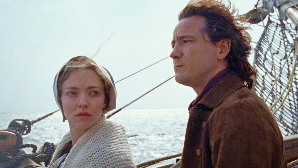 This image released by Searchlight Pictures shows Amanda Seyfried, left, and Lewis Pullman in a scene from "The Testament of Ann Lee." (Searchlight Pictures via AP)