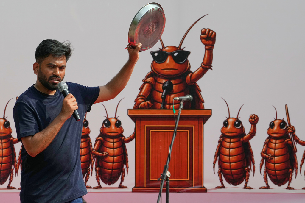 Abhijeet Dipke, founder of the Cockroach Janta Party speaks during a protest demanding the resignation of Education Minister Dharmendra Pradhan over alleged examination irregularities and repeated paper leaks, in New Delhi, India, Saturday, June 20, 2026. (AP Photo/Manish Swarup)