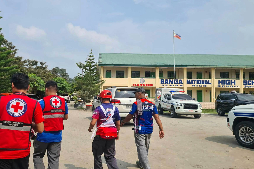In this handout photo provided by the Philippine Red Cross, Red Cross members arrive at Banga National High School in the town of Banga, Philippines, Friday, Sept. 18, 2026. (Philippine Red Cross via AP)