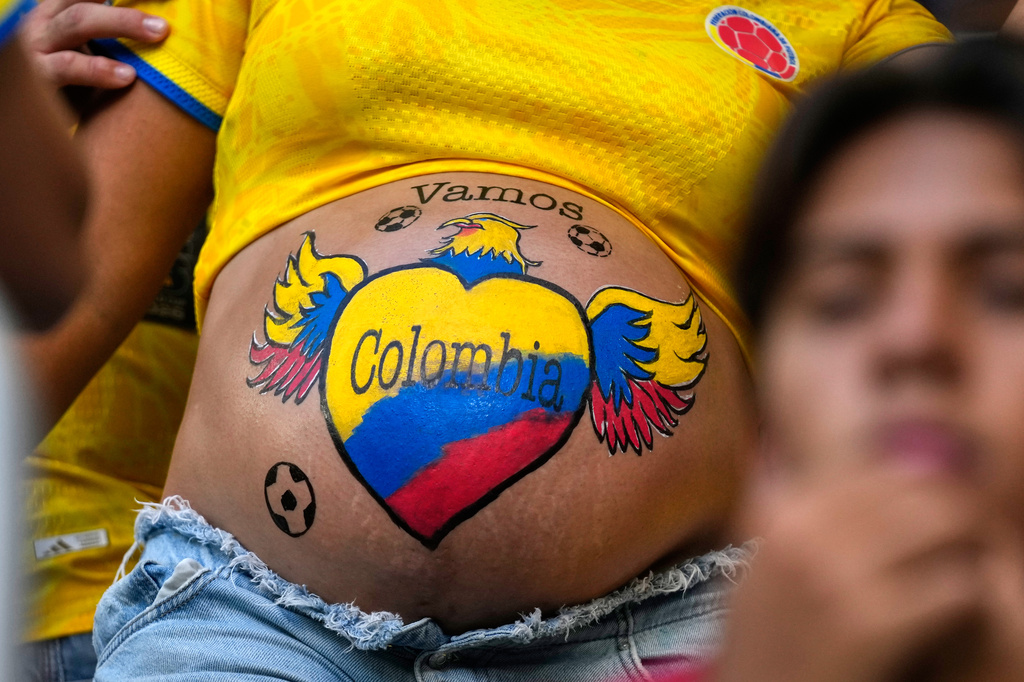 A supporter has her stomach painted in Colombia colours before the World Cup Group K soccer match between Colombia and Portugal in Miami Gardens, Fla., Saturday, June 27, 2026. (AP Photo/Lynne Sladky)