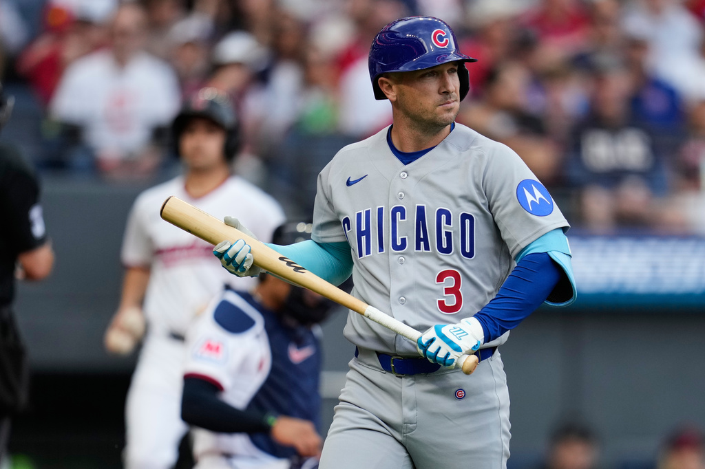 Chicago Cubs' Alex Bregman walks to the dugout after striking out in the first inning of a baseball game against the Cleveland Guardians in Cleveland, Friday, April 3, 2026. (AP Photo/Sue Ogrocki)
