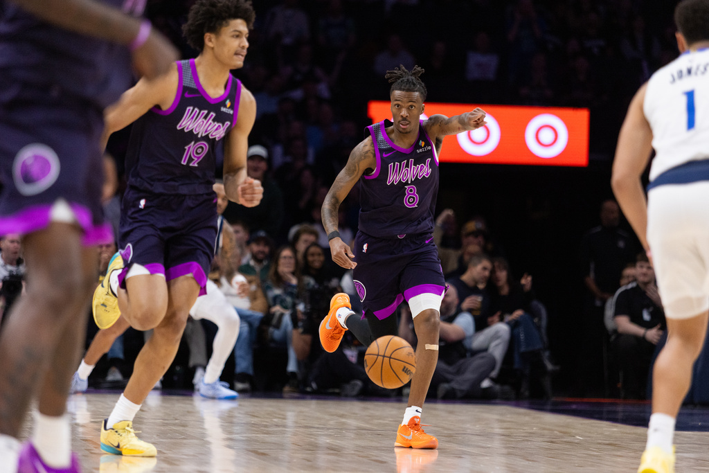Minnesota Timberwolves' Bones Hyland (8) communicates with a teammate against the Dallas Mavericks during the first half of an NBA basketball game Friday, Feb. 20, 2026, in Minneapolis. (AP Photo/Lily Dozier)